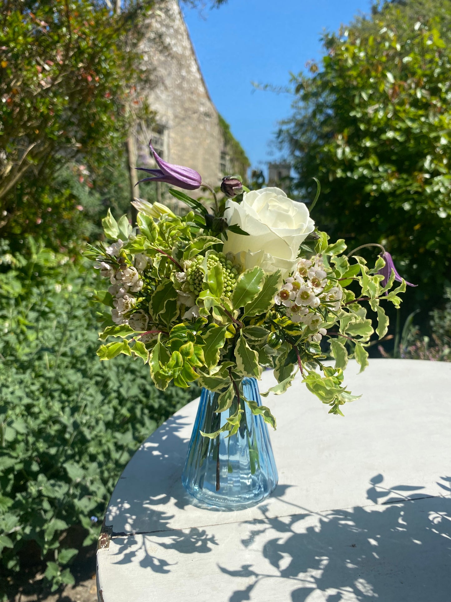 Triangle Glass Bud Vase in Ice Blue & a posy of seasonal flowers