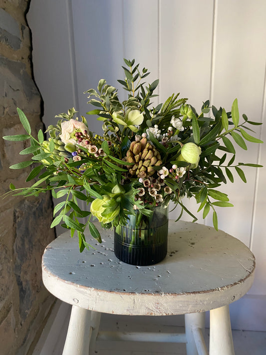 Nkuku Mila Dark Emerald Tumbler Glass with seasonal posy