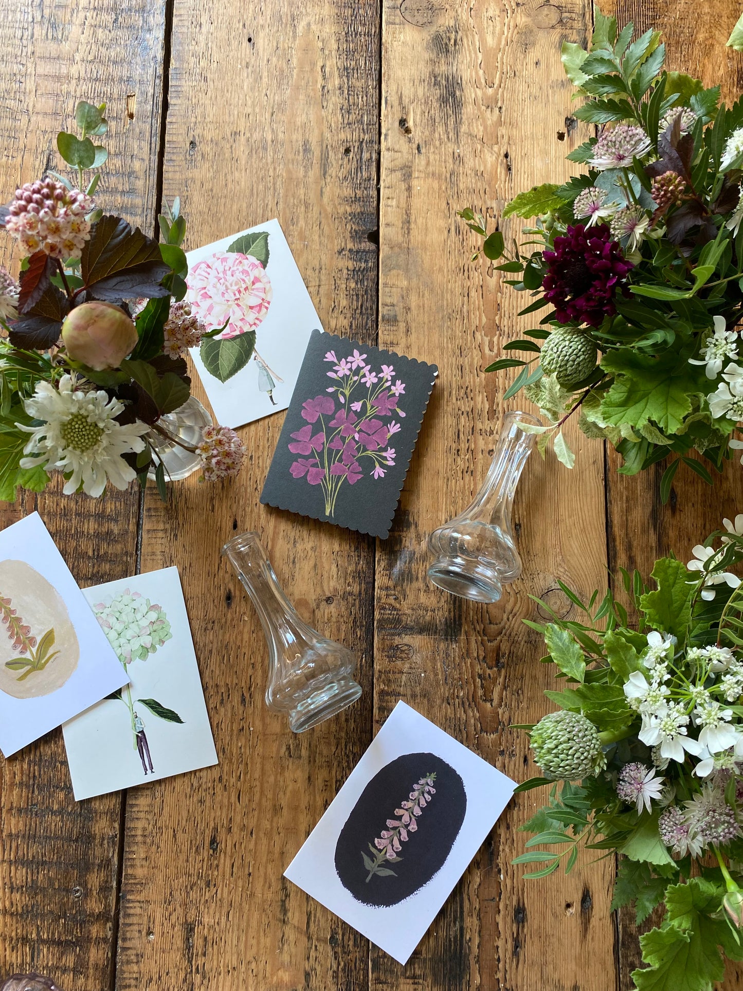 A Bedside Duo Of Pretty Bud Vases - including a seasonal posy in each vase
