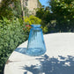 Triangle Glass Bud Vase in Ice Blue & a posy of seasonal flowers