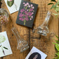 A Bedside Duo Of Pretty Bud Vases - including a seasonal posy in each vase